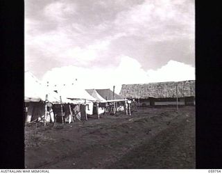 KOITAKI, NEW GUINEA. 1943-11-03. LOOKING UP THE CENTRE OF THE 47TH AUSTRALIAN CAMP HOSPITAL, LEFT TO RIGHT WARD 4, CANTEEN AND PACK STORE SECTION OF THE ADMINISTRATIVE BUILDING