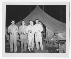 [Four Servicemen Drinking in Front of Tent on Guadalcanal]