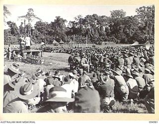 TOROKINA, BOUGAINVILLE. 1945-08-16. CHAPLAIN F.O. HULME-MOIR ADDRESSING TROOPS AT THE VICTORY THANKSGIVING SERVICE HELD AT GLOUCESTER OVAL FOR TROOPS OF THE AUSTRALIAN MILITARY FORCES