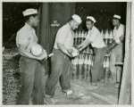 U.S. Navy African American enlisted members placing six-inches-shells in magazines at the Naval Ammunition base