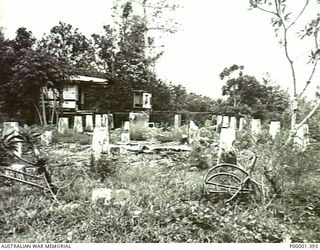 NEW IRELAND, 1945-10. REMAINS OF A FORMER ESTABLISHED BUILDING. (RNZAF OFFICIAL PHOTOGRAPH.)