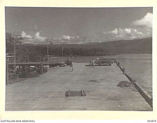 JACQUINOT BAY AREA, NEW BRITAIN. 1945-05. THE COMPLETED LIBERTY SHIP WHARF IN HEADQUARTERS 5 BASE SUB-AREA SHOWING DISCHARGING PLATFORMS. IN THE BACKGROUND IS PORTION OF THE BAY