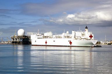 A port side stern view showing the US Navy (USN) Military Sealift Command (MSC), Hospital Ship, USNS MERCY (T-AH 19), as it approaches the Sea Based Radar during its port visit at Navy Base Pearl Harbor, Hawaii (HI). The USNS MERCY is starting a scheduled five-month deployment to deliver aid and humanitarian assistance to the Pacific Islands, and Southeast Asia