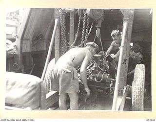 PURUATA ISLAND, SOUTH BOUGAINVILLE. 1945-05-29. THE IMPROVISED EQUIPMENT USED BY 42 LANDING CRAFT COMPANY TO LIFT ENGINES FROM BARGES DURING MAINTENANCE WORK