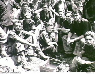 THE SOLOMON ISLANDS, 1945-05. SMOKO FOR A GROUP OF AUSTRALIAN ARMY PERSONNEL AT NORTH BOUGAINVILLE. (RNZAF OFFICIAL PHOTOGRAPH.)