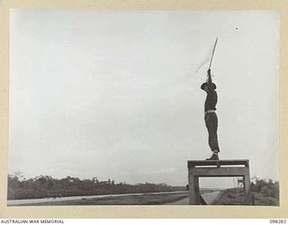 WEWAK, NEW GUINEA. 1945-10-26. A CEREMONIAL PARADE AND MARCH PAST BY 6 DIVISION WAS INSPECTED BY GENERAL SIR THOMAS A. BLAMEY, COMMANDER-IN-CHIEF, ALLIED LAND FORCES, SOUTH WEST PACIFIC AREA, AT ..