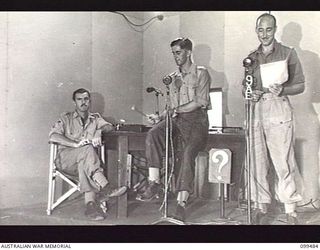 JACQUINOT BAY, NEW BRITAIN, 1945-11-22. THE "QUIZ" SESSION IN PROGRESS AT THE AUSTRALIAN ARMY AMENITIES SERVICE BROADCASTING STATION 9AE