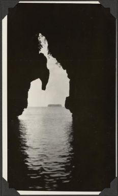 Opening in the cliff wall with an island in the distance, Apolima Island [?], Samoa, 1929 / C.M. Yonge