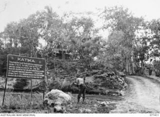 Katika, Finschhafen Area, New Guinea. 1944-03-21. A battle sign marking the enemy rallying point in prepared positions following their retreat from Scarlet Beach. This position was captured in ..