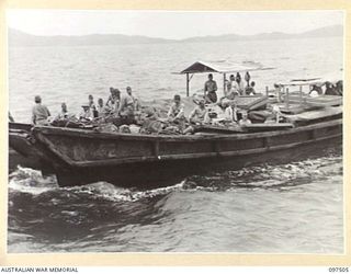 BOUGAINVILLE AREA. 1945-10-01. HIGH RANKING JAPANESE ARMY AND NAVAL OFFICERS ON BOUGAINVILLE WERE ESCORTED IN THEIR OWN BARGES FROM KAHILI BY MEMBERS OF 2 CORPS FOR CONCENTRATION ON SAMANSO ISLAND. ..