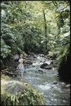 Anne Scheffler standing beside a creek