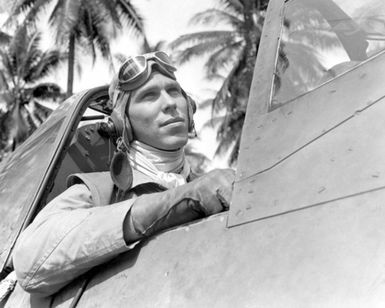 World War II (WWII) era photograph of US Marine Corps (USMC) First Lieutenant (1LT) Frank B. Baldwin, taken at Russell Islands July 3, 1943 as he sits in the cockpit of a USMC F4U"CORSAIR"aircraft. 1LT Baldwin is an Ace Pilot credited with 10 kills