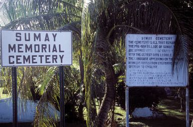 View of the entrance to the Sumay Memorial Cemetery. It is all that remains of the village of Sumay. The village was destroyed during the World War II liberation of Guam in July 1944. The earliest legible inscription dates back to 1911. The languages appearing on the tombstones include Chamorro, Spanish and English