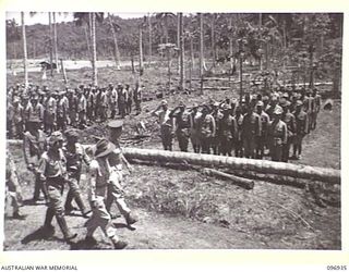 MUSCHU ISLAND, NEW GUINEA. 1945-09-24. MAJOR GENERAL H.C.H. ROBERTSON, GENERAL OFFICER COMMANDING 6 DIVISION, ACCOMPANIED BY SENIOR OFFICERS, INSPECTING JAPANESE NAVAL PERSONNEL. HE WILL INSPECT ..