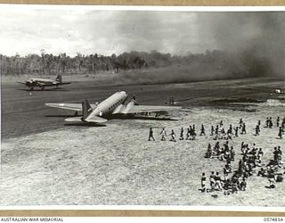 NADZAB, NEW GUINEA. 1943-09-20. TRANSPORT AIRCRAFT JUST TAKING OFF FROM NO. 1 AIRSTRIP