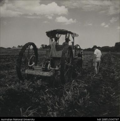 Famers on tractor with Field Officer