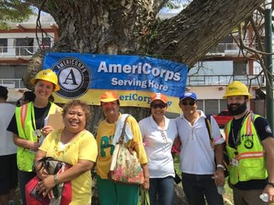 Mikenzie Rost and Jackson Owens, with community volunteers. On Friday, October 23rd, the AmeriCorps Disaster Response Team supported a large-scale volunteer event in Chalan Kanoa in coordination with United for Saipan and the LTRG (CARE). The AmeriCorps Disaster Response Team members trained and led 25 volunteers in canvassing the Chalan Kanoa neighborhood with two goals in mind: to bring to light the community's unmet needs, and to determine work sites for the Saturday and Sunday volunteer events. Over Saturday & Sunday, volunteers went through the neighborhood to gather debris for removal, collected information from additional clients about their unmet needs, and received training on client intakes for unmet needs. In total at this event, 77 client intakes were completed, 140 cubic yards of tin & vegetative debris were removed, and a total of 391 volunteer hours were logged by 117 volunteers supporting the Cleanup events over Friday, Saturday & Sunday.