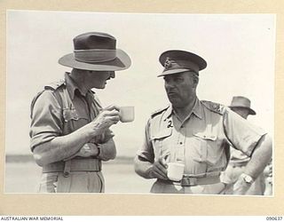 NADZAB, NEW GUINEA. 1945-04-14. LIEUTENANT GENERAL J. NORTHCOTT, CHIEF OF THE GENERAL STAFF (2), HAVING TEA AT THE AERODROME SHORTLY BEFORE HIS DEPARTURE FROM HEADQUARTERS FIRST ARMY FOR AUSTRALIA