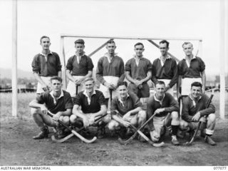 LAE, NEW GUINEA. 1944-11-18. THE HOCKEY TEAM OF A COMPANY, 18TH FIELD AMBULANCE WHO ARE TO PLAY AN OPPOSING B COMPANY TEAM ON THE UNIT SPORTS GROUND. IDENTIFIED PERSONNEL ARE:- DRIVER V. FAGG (1); ..