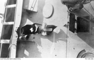 ORO BAY, PNG, 1943-04-11. THE BRIDGE OF HMAS PIRIE, SHOWING THE HOLE WHERE A BOMB PENETRATED. (DONOR J. LYALL)