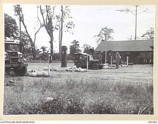 LAE AREA, NEW GUINEA. 1945-07-12. FOUR ELECTRIC METER PUMPS AT THE LAE PETROL POINT OPERATED BY 2 BULK PETROLEUM STORAGE COMPANY