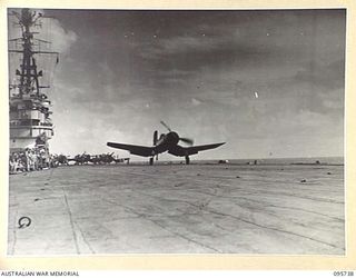 AT SEA OFF RABAUL, NEW BRITAIN. 1945-09-06. CORSAIR AIRCRAFT TAKING OFF FROM THE AIRCRAFT CARRIER HMS GLORY TO PROVIDE AIR COVER DURING THE SIGNING OF THE SURRENDER OF ALL JAPANESE FORCES IN NEW ..