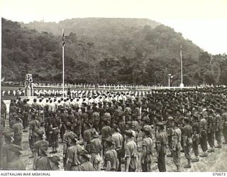 FINSCHHAFEN, NEW GUINEA, 1944-02-29. THE OFFICIAL OPENING OF THE FINSCHHAFEN WAR CEMETERY BY VX20308 MAJOR-GENERAL F.H. BERRYMAN, CBE, DSO, OFFICER COMMANDING 2ND AUSTRALIAN CORPS, WHO UNVEILED THE ..