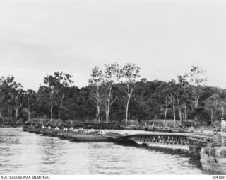 ORO BAY, NEW GUINEA. 1943-01. THE PONTOON WHARF LOOKING TOWARDS THE LANDWARD END. (NAVAL HISTORICAL COLLECTION)