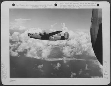 Consolidated B-24 "Liberator" Of The 11Th Bomb Group Over Kwajalin, Marshall Islands, June 1944. (U.S. Air Force Number B63766AC)