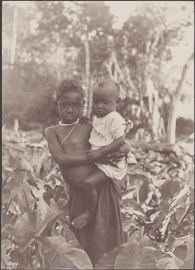 Girl carrying a young child at Roapu, Malaita, Solomon Islands, 1906 / J.W. Beattie