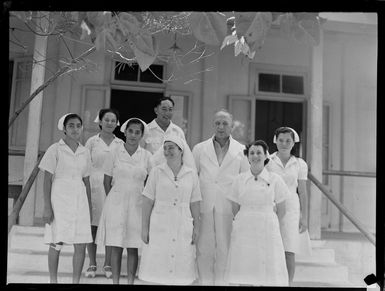Unidentified nurses and doctor, with patients outside hospital, Rarotonga, Cook Islands