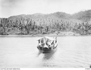 KIEP, NEW BRITAIN. 1945-02-08. THE CAPTURED JAPANESE BARGE RECONDITIONED AND USED BY THE 2/137TH ARMY WORKSHOPS RETURNING TO BASE AFTER TRANSPORTING THE GENERAL OFFICER COMMANDING, 5TH DIVISION OUT ..