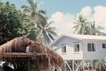 Tokelau house under construction beside schoolteacher's quarters