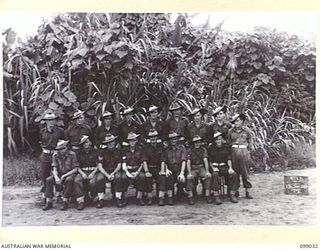 Group portrait of the personnel of 136 Supply Depot Platoon, 30 Advanced Supply Depot. Left to right, back row: NX152802 Private (Pte) F V Coffey of West Maitland, NSW; QX15975 Pte J T Fletcher of ..