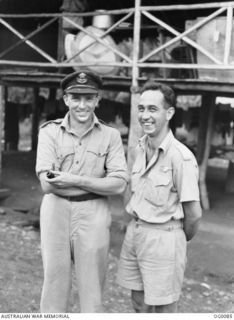 PORT MORESBY, PAPUA. C. 1943-07. WING COMMANDER CLARRIE GLASSCOCK (LEFT) OF ABBOTTSFORD POINT, SQUADRON CO, AND FLYING OFFICER NED KELLEY OF NEWCASTLE, NSW, OF NO. 30 (BEAUFIGHTER) SQUADRON RAAF. ..