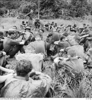 NEW GUINEA. GONA. CHURCH SERVICE BEFORE GOING INTO BATTLE, PADRE R.M. PARK. (NEGATIVE BY G. SILK)