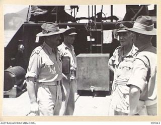 RABAUL, NEW BRITAIN. 1945-09-20. LIEUTENANT GENERAL V.A.H. STURDEE, GENERAL OFFICER COMMANDING FIRST ARMY, BEING MET AT THE BEACH-HEAD BY LIEUTENANT COLONEL L.M. CHAPMAN ASSISTANT ADJUTANT AND ..