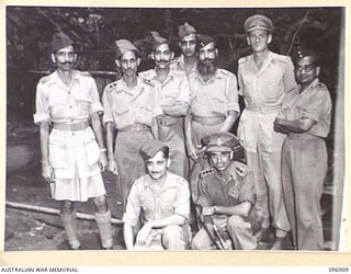 KUMUIA YAMA, RABAUL AREA, NEW BRITAIN. 1945-09-17. A GROUP OF LIBERATED INDIAN ARMY OFFICERS AT THE INDIAN PRISONER OF WAR CAMP, THE OFFICERS WITH THE EXCEPTION OF MAJOR H.G. COMBES, THE INDIAN ..