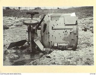 HANSA BAY, NEW GUINEA. 1944-06-19. A LARGE ENEMY SEARCHLIGHT WHICH WAS WRECKED BY THE JAPANESE BEFORE THEY EVACUATED THE AREA