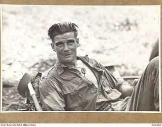 UBERI, NEW GUINEA. 1943-12-19. QX37545 PRIVATE D. DELANEY OF THE 2/9TH AUSTRALIAN INFANTRY BATTALION, WHO PLAYED THE PART OF AN EXTRA DURING THE FILMING OF SEQUENCES FOR THE "RATS OF TOBRUK" BY ..