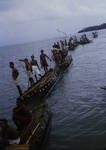 [Eight canoes in water, men looking out to sea, Governor General's tour,1964]