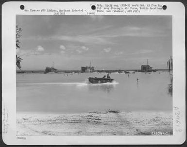 Unloading Equipment From Three Lst (Landing Ship Tanks) During Landing Operations On Saipan, Marianas Islands, June 21, 1944. (U.S. Air Force Number 63658AC)