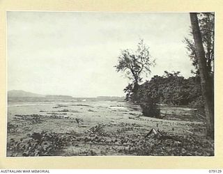 TSIMBA AREA, BOUGAINVILLE ISLAND. 1945-02-13. LOOKING FROM THE CAMP AREA OF THE 31/51ST INFANTRY BATTALION AT THE MOUTH OF THE GENGA RIVER NORTH WEST ACROSS TO TAIOF ISLAND. IT IS BELIEVED THAT THE ..