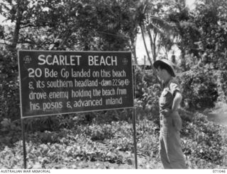 SCARLET BEACH, FINSCHHAFEN AREA, NEW GUINEA. 1944-03-13. ONE OF MANY BATTLE SIGNS IN THE FINSCHHAFEN AREA, THIS SIGN RECORDS THE LANDING BY THE 20TH INFANTRY BRIGADE GROUP