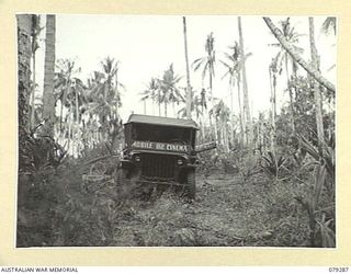 KALAI PLANTATION, HENRY REID BAY, NEW BRITAIN. 1945-02-17. THE JEEP OF THE 82ND MOBILE CINEMA, IN THE PLANTATION SOON AFTER ITS CAPTURE FROM THE ENEMY