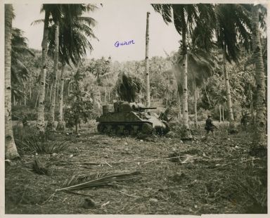 Marines advancing aided by tank