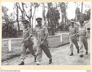 TOROKINA, BOUGAINVILLE. 1945-06-08. LIEUTENANT GENERAL V.A.H. STURDEE, GENERAL OFFICER COMMANDING FIRST ARMY, WALKING WITH MAJOR GENERAL W. BRIDGEFORD, GENERAL OFFICER COMMANDING 3 DIVISION, DURING ..