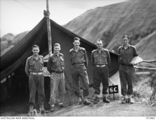 DUMPU, NEW GUINEA. 1944-04-20. STAFF OFFICERS AT HEADQUARTERS 15TH INFANTRY BRIGADE. IDENTIFIED PERSONNEL ARE:- VX102654 LIEUTENANT L.S. PROBY, MC, (1); VX112180 CAPTAIN S.R. HEDLEY (INTELLIGENCE ..