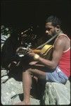 Sale 'Oirukua playing guitar