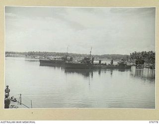 MADANG, NEW GUINEA. 1944-10-30. THE RAN SHIPS VENDETTA (NEAR CAMERA) AND BARCOO AT ANCHOR IN THE HARBOUR